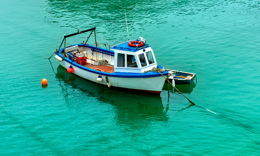 The harbour with a fishing boat moored after a days fishing in Newquay, Cornwall, England, UK.