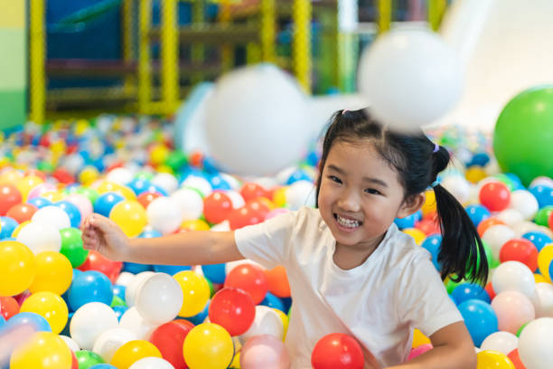 istock Cute girl at the Ball Pool 1262668981