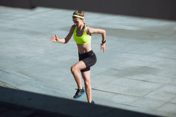 istock Female runner, athlete training outdoors in summer's sunny day. 1262669024
