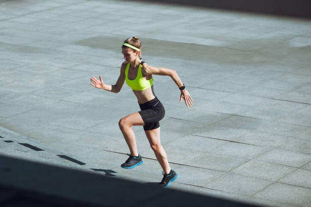 istock Female runner, athlete training outdoors in summer's sunny day. 1262669029