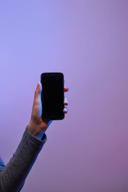 istock Human's hands with smartphone and blank black screen 1262669149