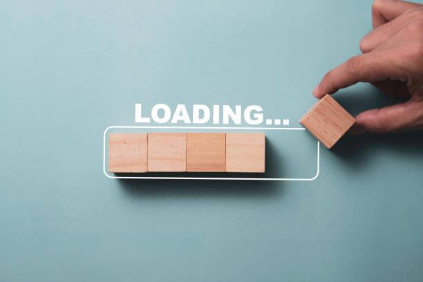istock Hand putting wooden cube on virtual infographic rectangle block with loading wording. Job and electronic download progressive concept. 1262670621