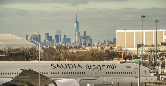 Kennedy Airport, Dec. 12, 2015, a Saudia Airlines aircraft and the Manhattan skyline in the background