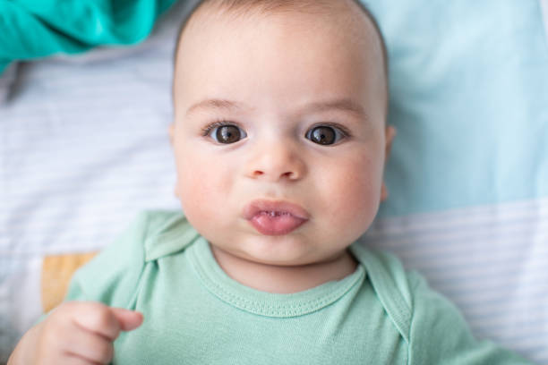 istock Cute baby boy in crib 1262671834