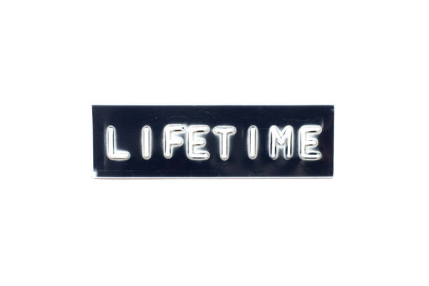 istock Embossed letter in word lifetime on black banner with white background 1262672090