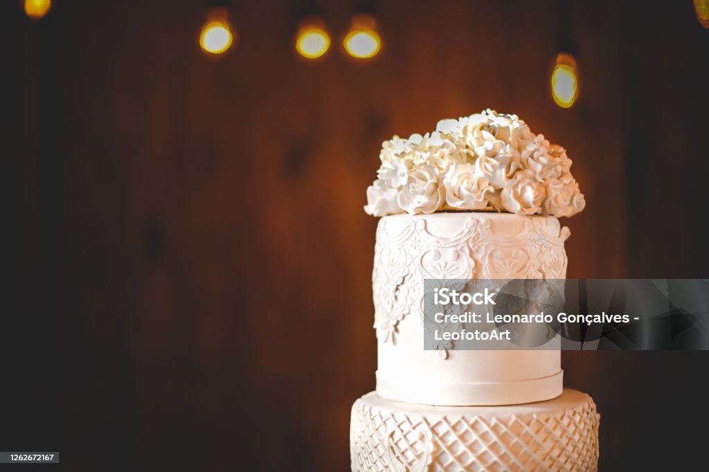 Wedding Cake Wedding cake with brown background Close-up Stock Photo