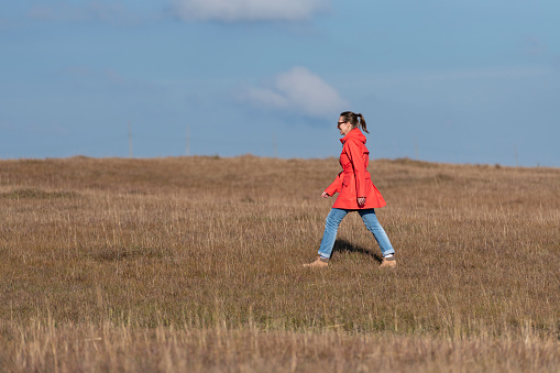 Woman walking in the outdoors