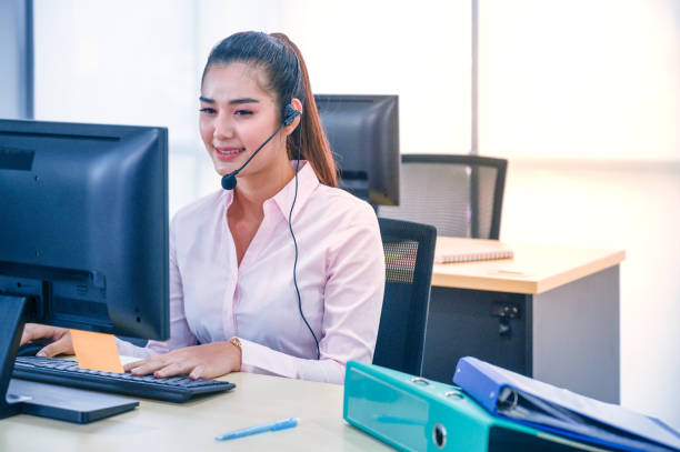 istock Young customer service women agent with headsets and computer working at office. 1262675768