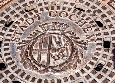 Cochum manhole cover decorated with landmarks