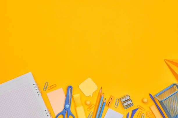 istock minimalism yellow-blue stationery on yellow background school, university, flat layer, copy space one 1262680082