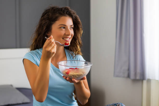 istock Woman eating cereals 1262680766