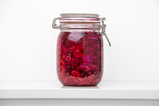 Mason jar with beetroot against white background