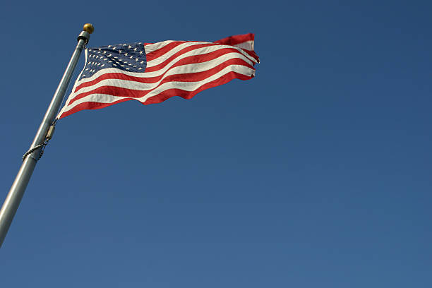 istock American flag against a blue sky 126268157