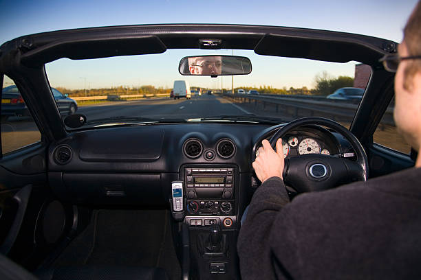 istock View from inside sports car of man driving 126268384