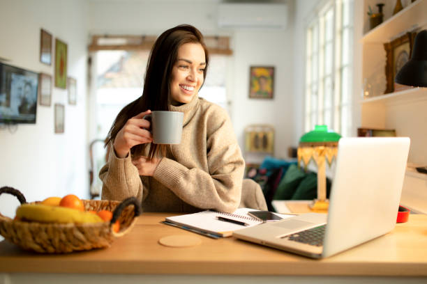 istock Happy female freelancer working from home 1262684346