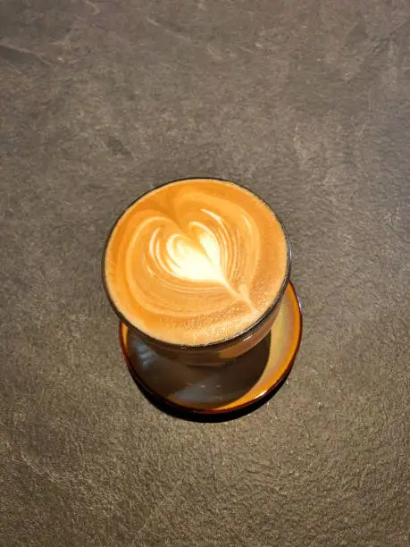 Flatwhite Heartshaped Art Coffee on a gravel base