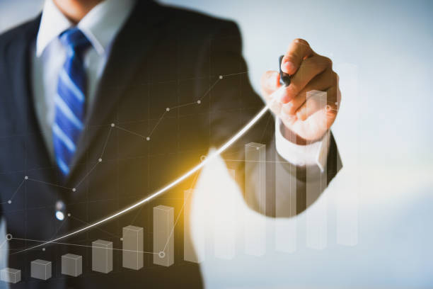 istock Businessman pointing arrow graph, business analytics and financial technology concept. 1262687817
