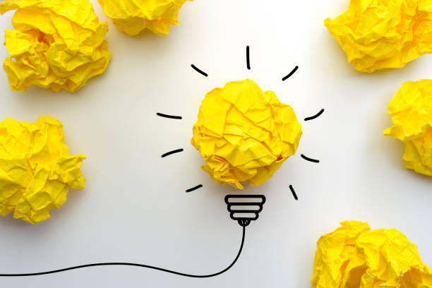 istock Creative idea. Good idea and Inspiration with paper light bulb on white background 1262688899