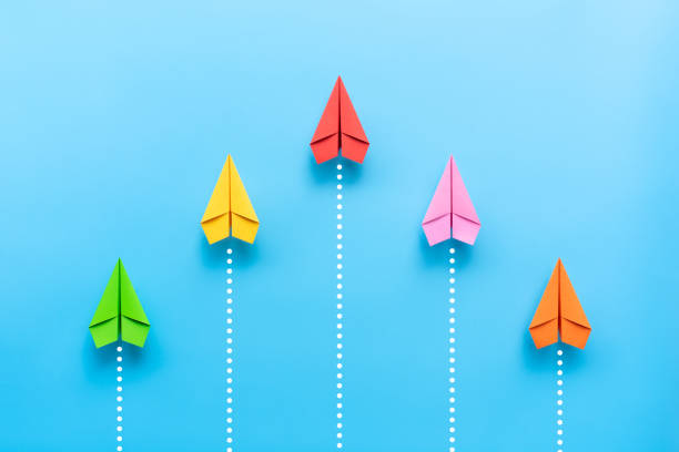 istock Paper plane on blue background, Business competition concept. 1262688975