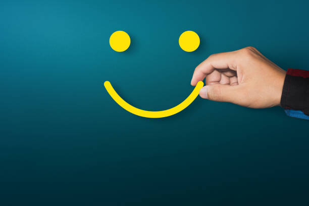 Customer service experience and satisfaction survey concept with happy face icon. Copy space stock photo
