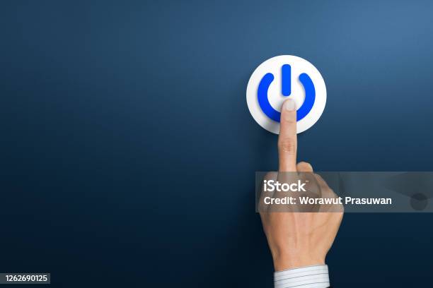 Hand Of The Businessman Pressing Power Button Start Up Business Concept Stock Photo - Download Image Now