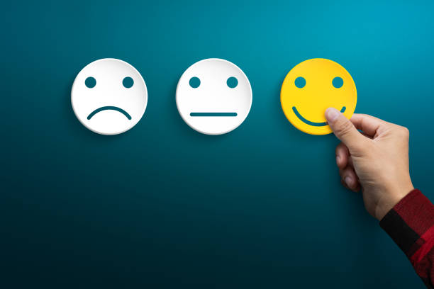 istock Customer service experience and satisfaction survey concepts. The client's hand picked the happy face smile face. 1262691842