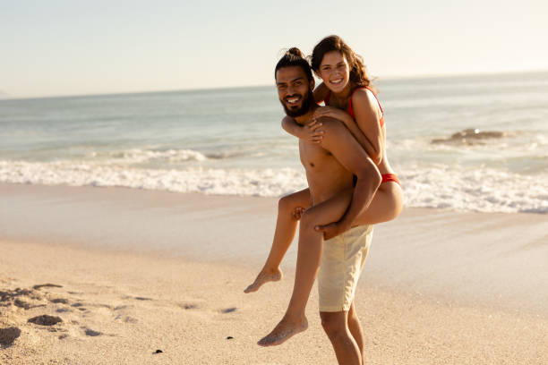 istock Caucasian couple having fun on the beach 1262692026