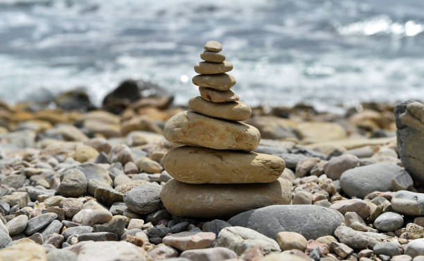 istock a tower of stones on the beach 1262703042