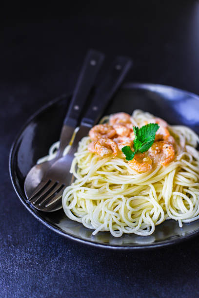 istock pasta shrimp spaghetti creamy prawn seafood sauce main dish second course food background top view copy space for text organic healthy eating 1262704589