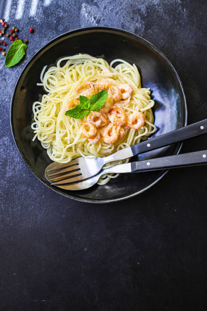 istock pasta shrimp spaghetti creamy prawn seafood sauce main dish second course food background top view copy space for text organic healthy eating 1262704641