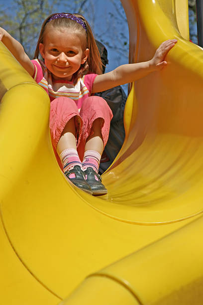 istock Young girl has fun on the slide 126270664