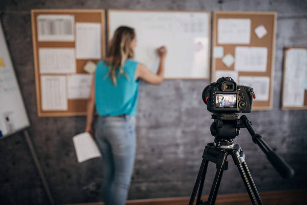 istock Young female teacher is recording classes on a digital camera 1262706954