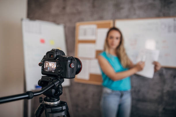 istock Female teacher is recording classes on a digital camera 1262707497