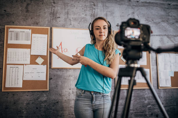 istock Woman teacher is recording classes on a digital camera 1262708534