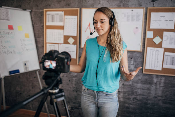 istock Young female teacher is recording classes on a digital camera 1262709663