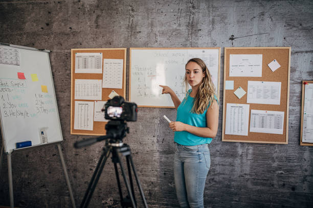 istock Woman teacher is recording classes on a digital camera 1262711237