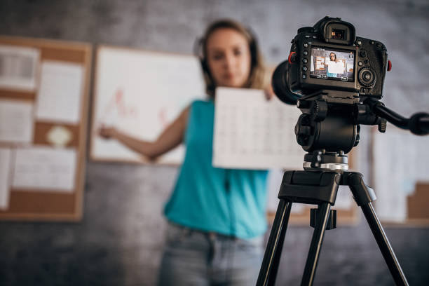 istock Woman teacher is recording classes on a digital camera 1262711763