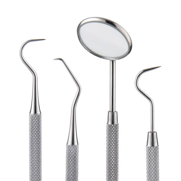 Dental tools. Mirror scaler and sickle probe dental explorer on white
