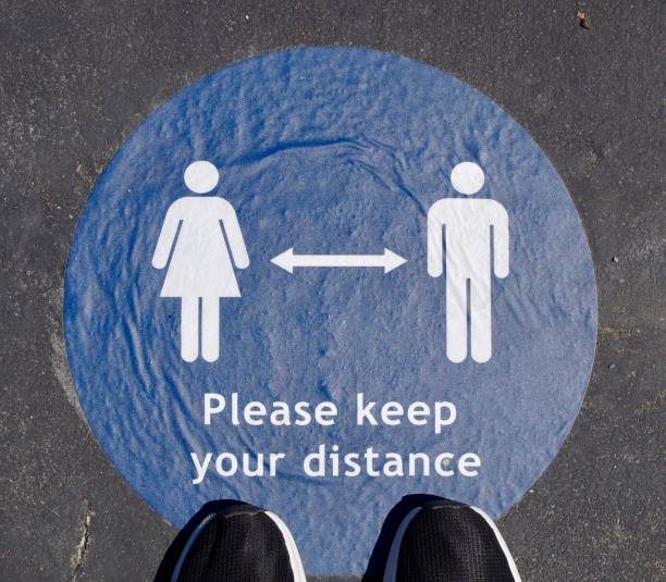 istock Covid 19 related Keep your distance markings on the ground 1262726018