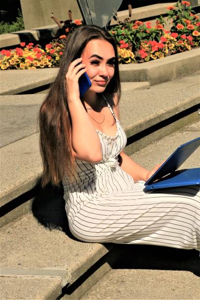 istock Woman on Phone and Computer 1262729686