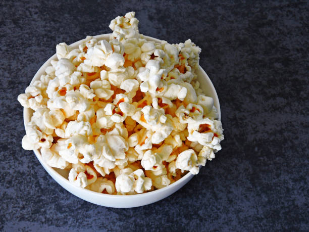 istock Air fluffy popcorn in a white bowl. 1262733617