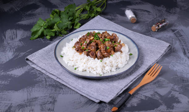istock Stewed chicken gizzards on the boiled rice 1262738707