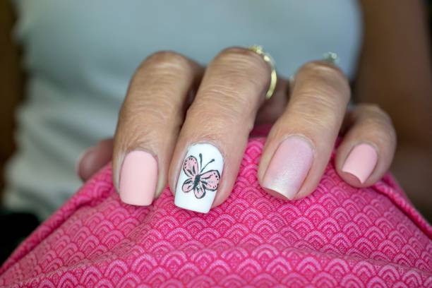 istock Pink Butterfly Nail Art Design 1262740992