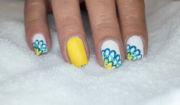 Flower Petal Nail Art Design Summer Inspired Art yellow nail polish stock pictures, royalty-free photos & images