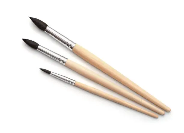 Photo of Top view of new  artistic paint brushes set