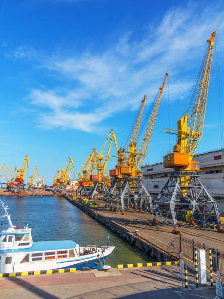 istock Odessa, Ukraine - July 6, 2016: Container cranes in cargo port terminal, cargo cranes without job in an empty harbor port. A crisis. Defaulted paralyzed entire economy of state 1262746834