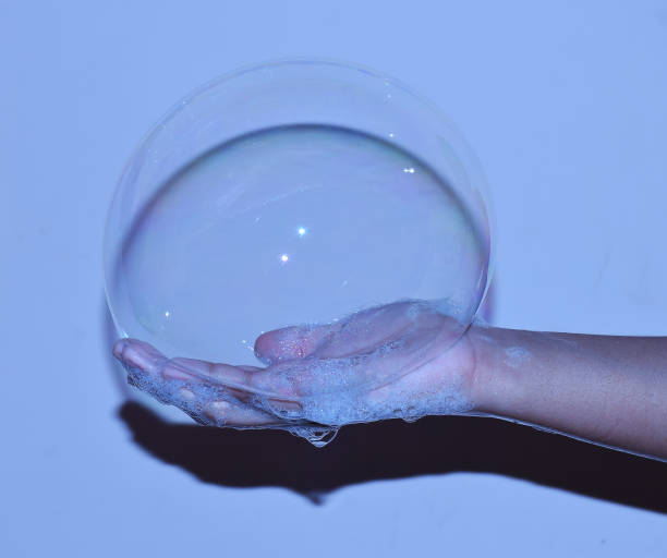istock A big soap bubble in hand of a child 1262748914