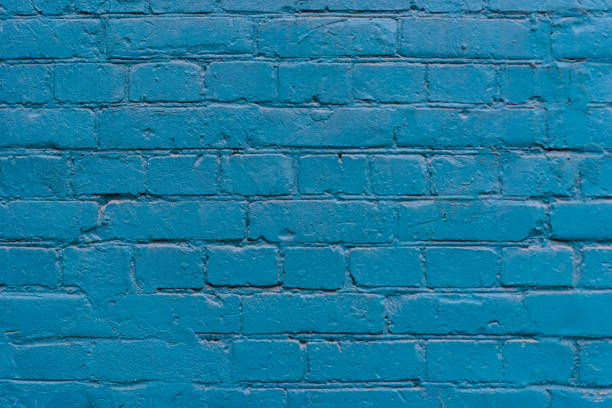 istock brick blue wall texture. background of a old brick house. 1262749246