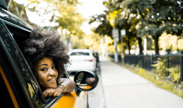 istock Young black woman inside the car 1262757064