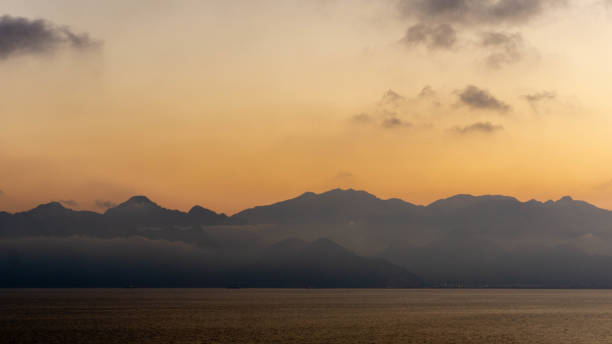 istock majestic mountains covered with clouds and fog 1262759644